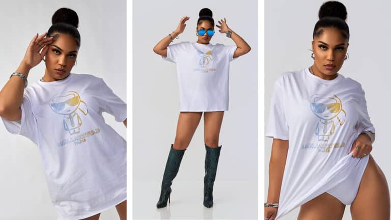 Model posing in oversized Karl Lagerfeld T-shirt with sleek bun and bold expression, fashion editorial studio shot.